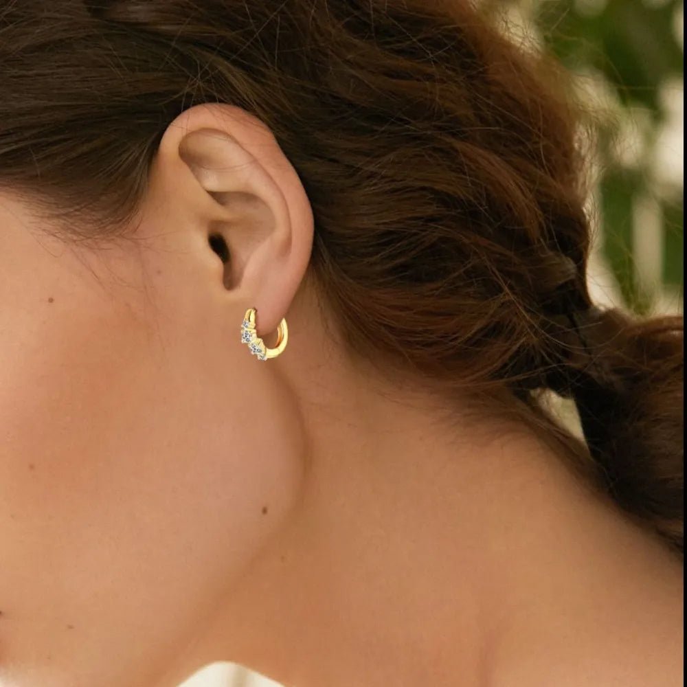 Sterling silver huggie earrings with lab-created moissanite stones, minimalist sparkle design