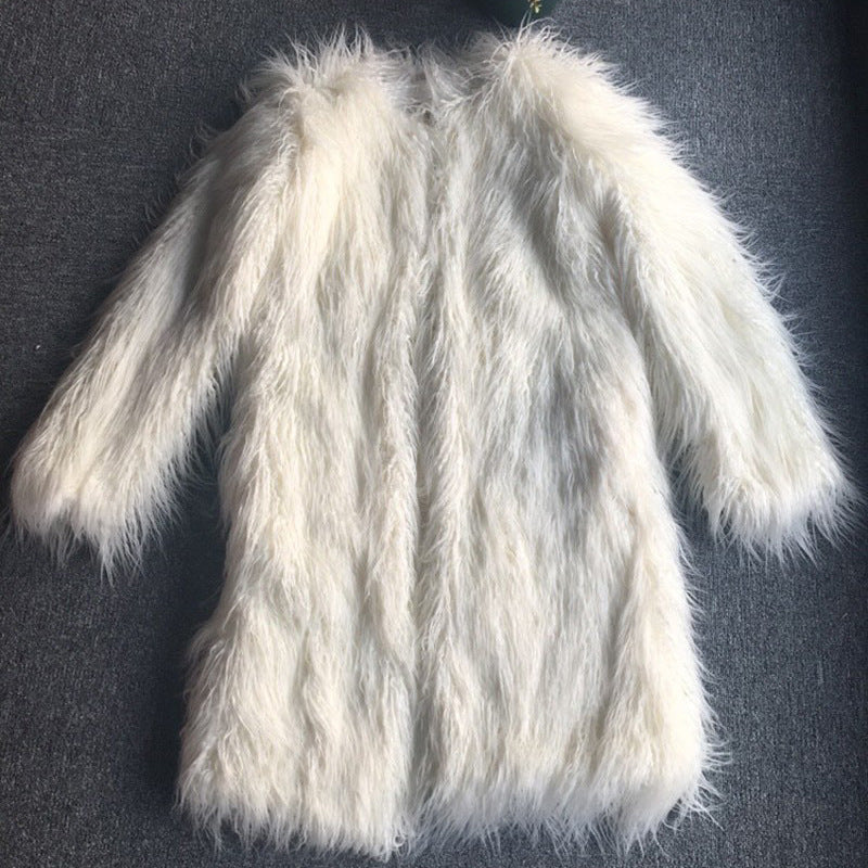 Shaggy faux-fur long coat in white, flat lay view on a dark surface, showing full length and texture.