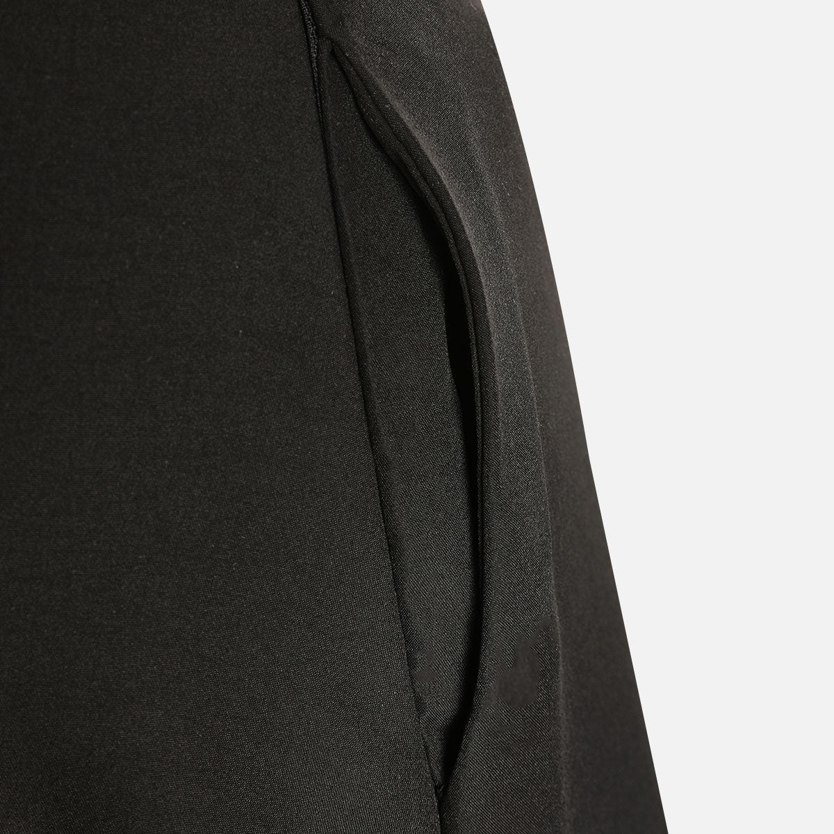 Close-up of the black maxi skirt side pocket, set into a vertical seam