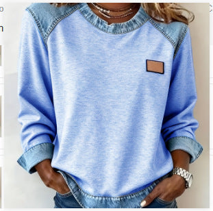 Light blue long-sleeve waffle-knit top with denim-look yoke and chest patch, front view on model