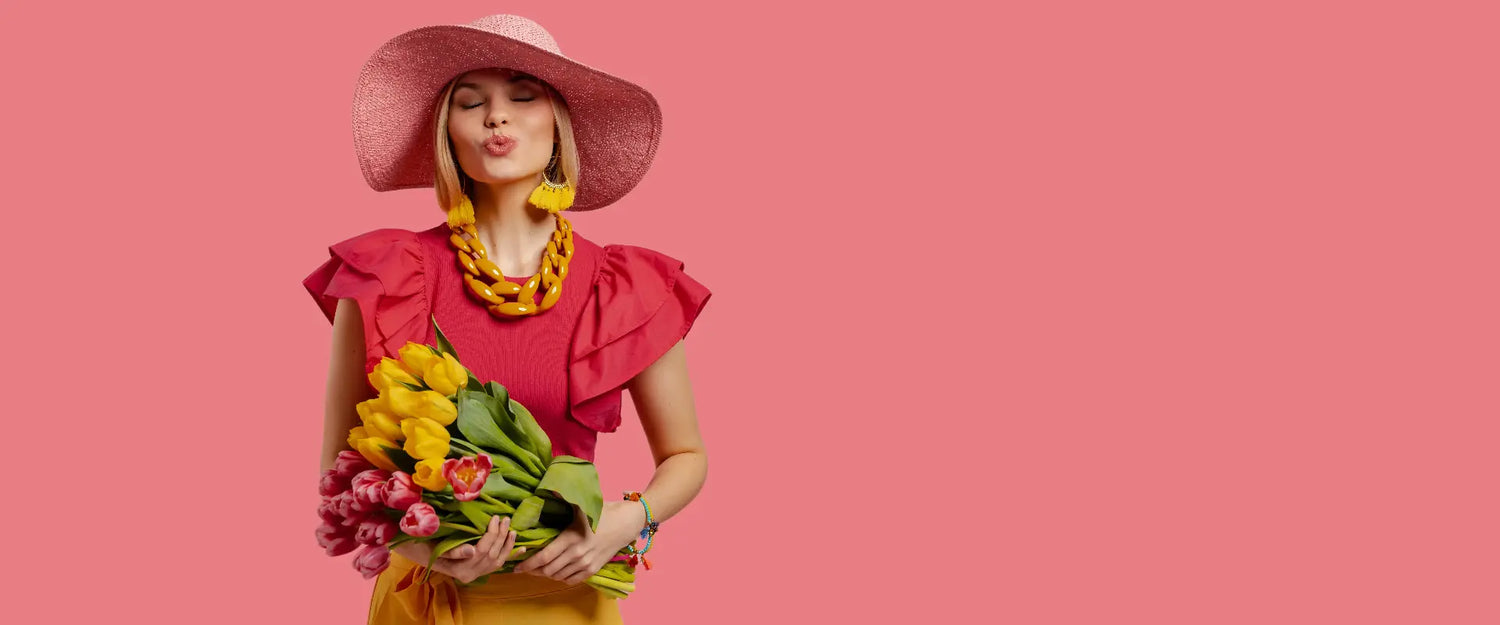 Spring fashion collection - Woman in pink dress with flowers showcasing WOW Store lifestyle essentials