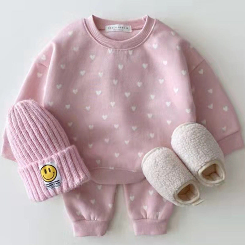 Pink set with white hearts laid flat