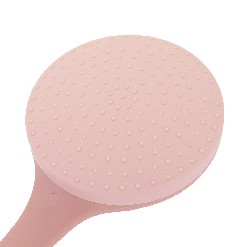 Close-up of the round silicone head of the back lotion applicator with small soft nubs