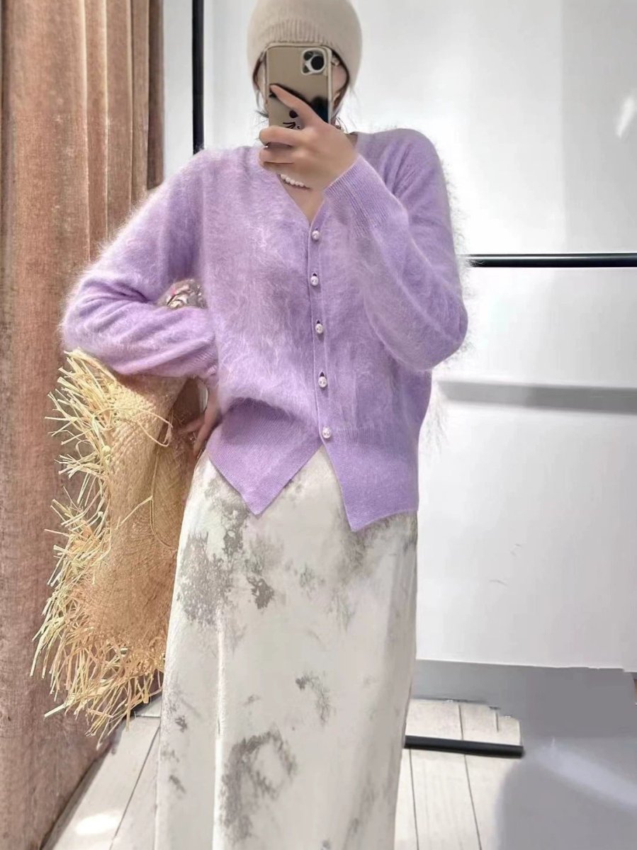 Taro purple brushed cardigan with pearl-look buttons, worn by a model over a long printed skirt