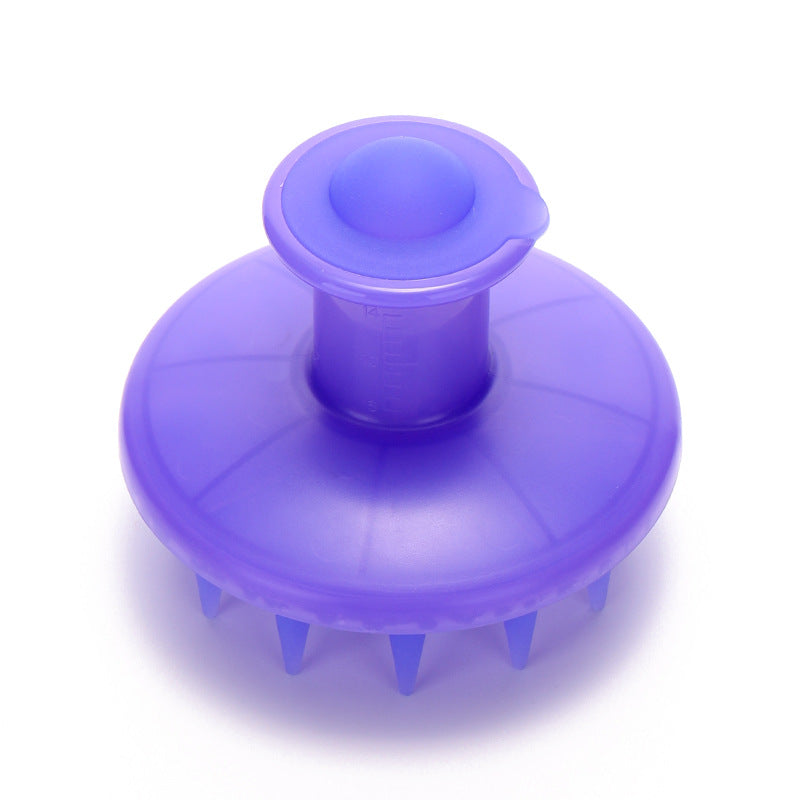 Top view of the lavender scalp brush, showing the rounded reservoir cap