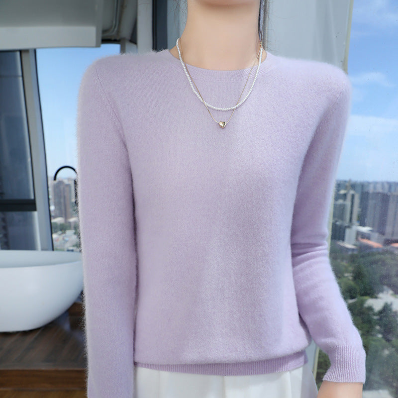 Lilac mercerised wool crew-neck sweater on a model, front view with city view in the background