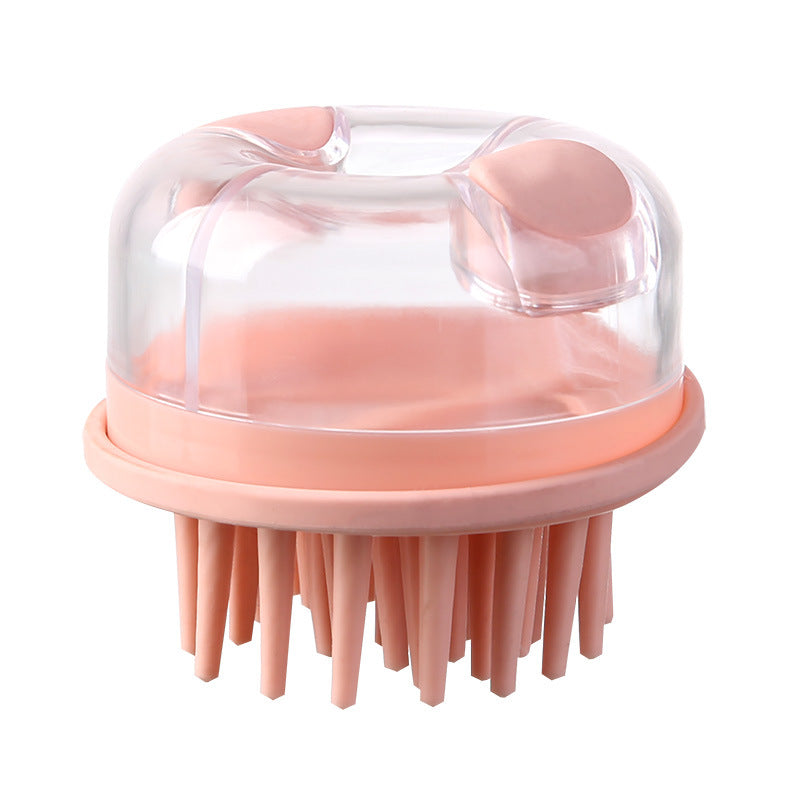Pink shampoo brush with dispenser, front view against a white background