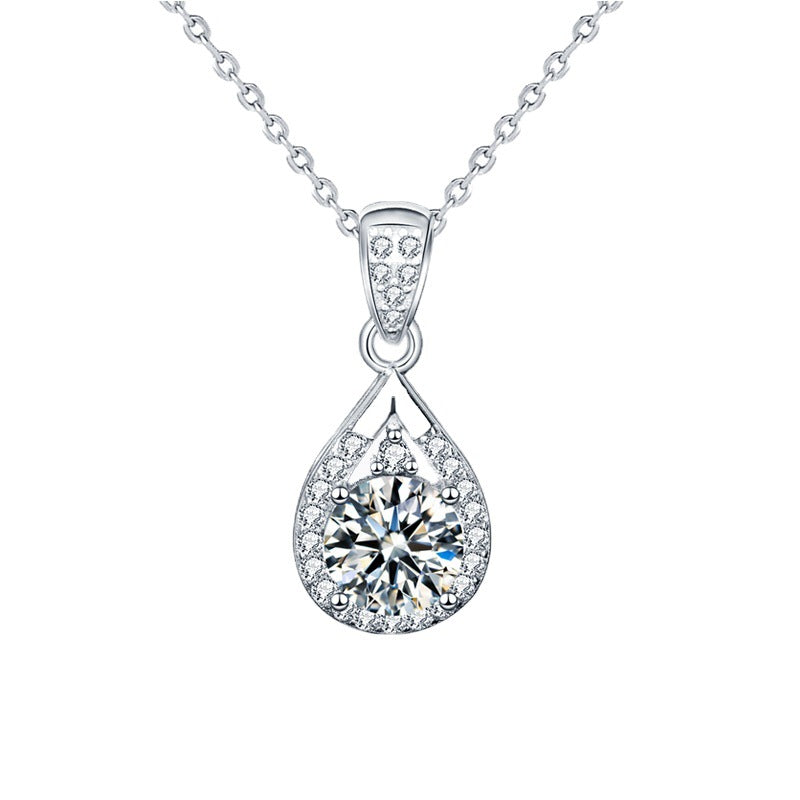 Teardrop pendant necklace on a plain white background, front view showing the full halo and cable chain
