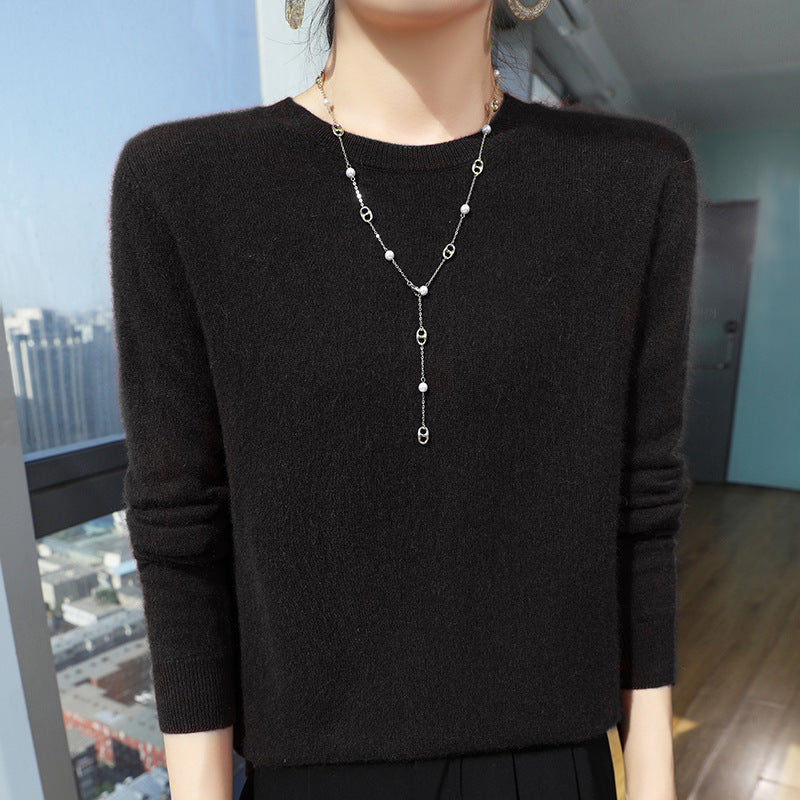 Black mercerised wool crew-neck sweater on a model, front view