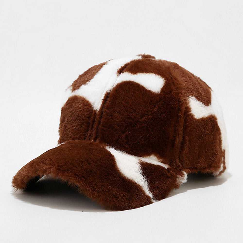 Plush animal-print baseball cap in brown and white cow-spot pattern, front view on white background