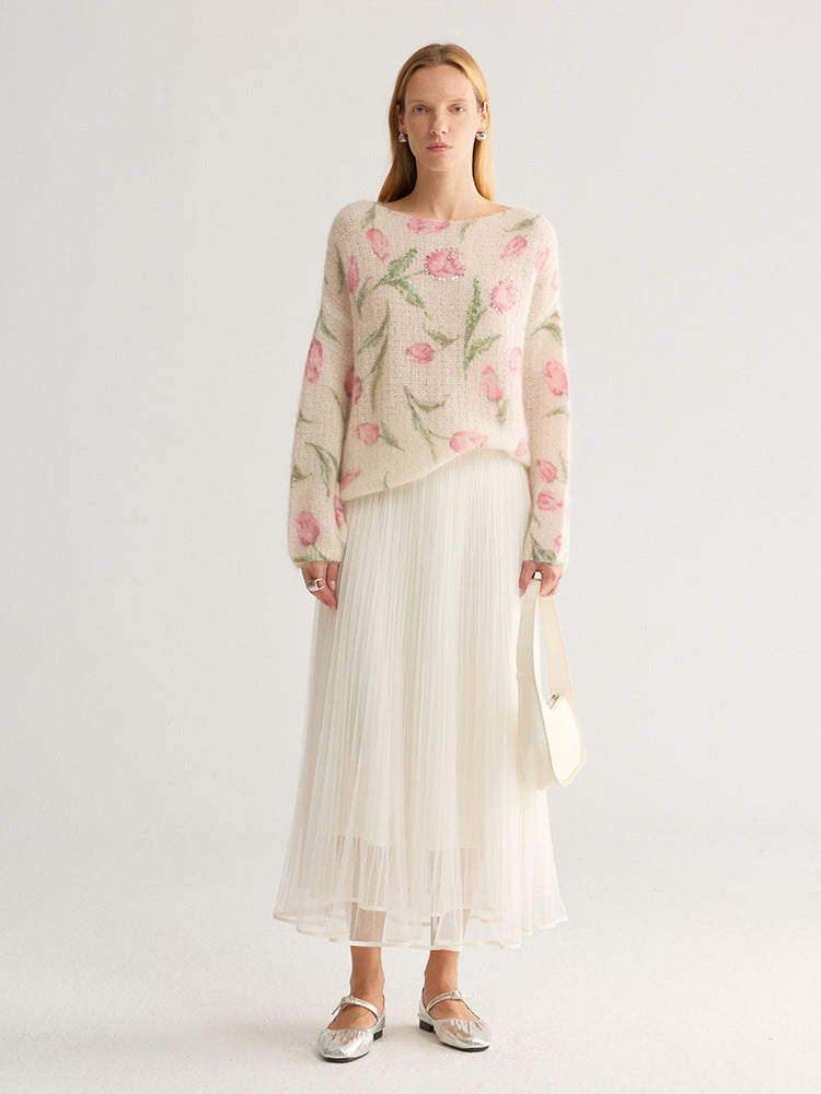 Tulip and floral print fuzzy knit jumper, wide neck, cream with pink flowers, full length on model with pleated skirt, studio