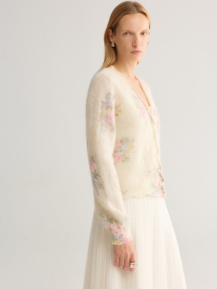 Floral jacquard V-neck cardigan with pearl-look buttons, cream base with pastel floral print, side view on model wearing