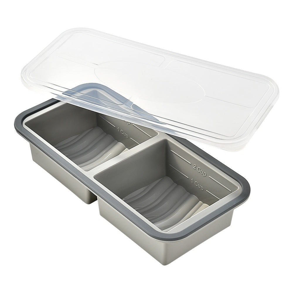 Two-compartment silicone freezer portion tray, grey colour, grey rim, clear lid, measuring marks, front view