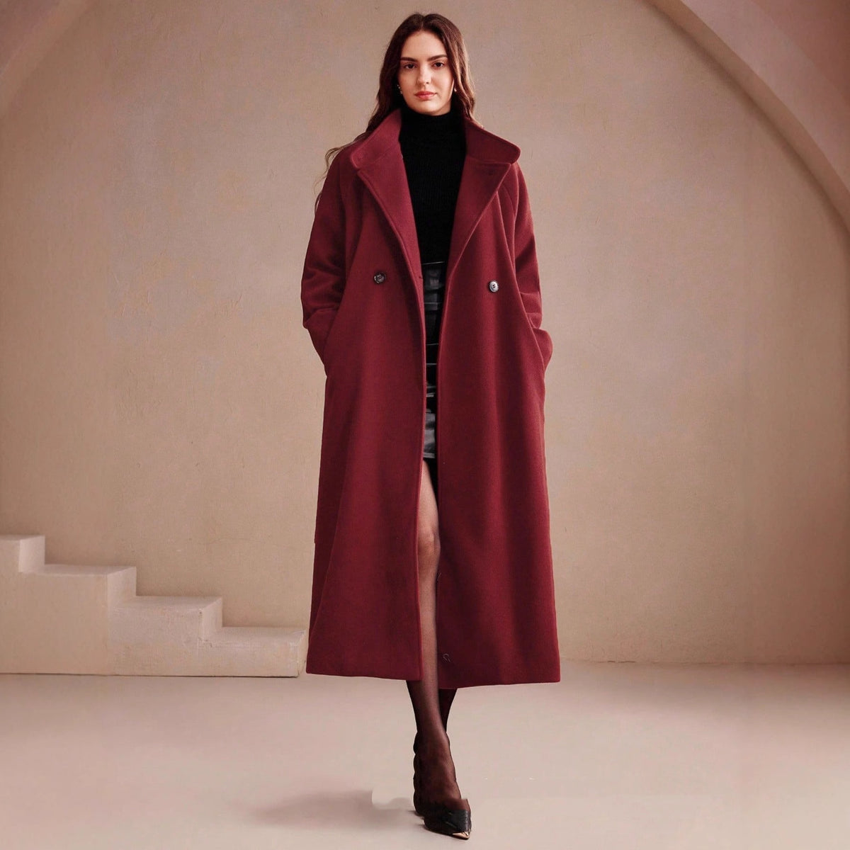 Long double-breasted wrap coat in wine red, wide lapel, model walking, front view