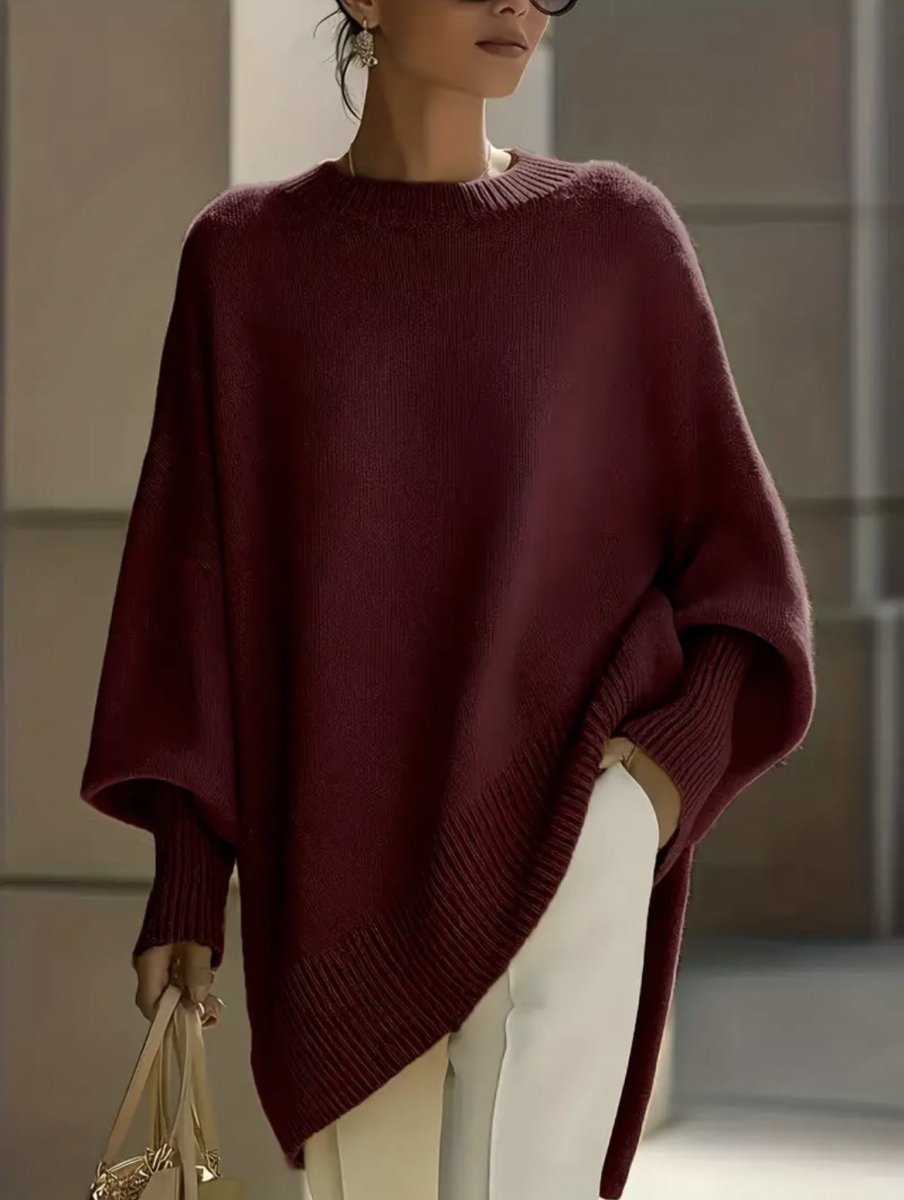 Burgundy poncho-style sweater with slanted ribbed hem