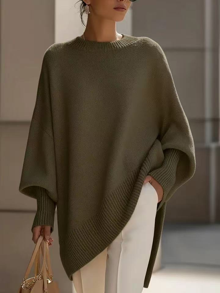 Dark green poncho-style sweater, hem longer on one side