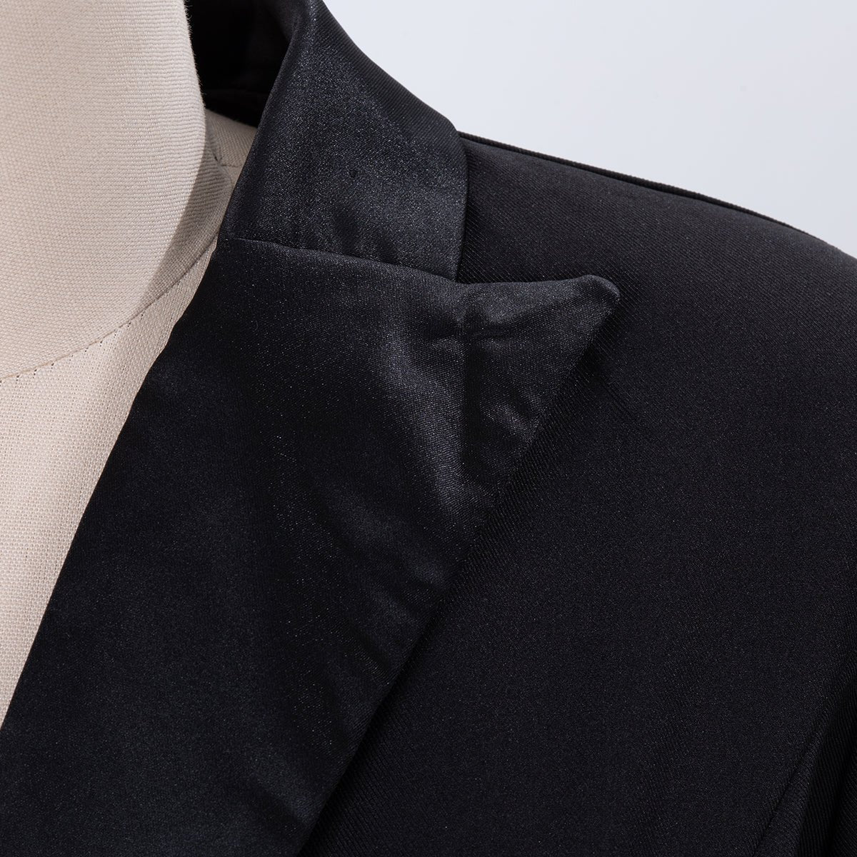 Close-up of the peaked lapel with its shiny finish