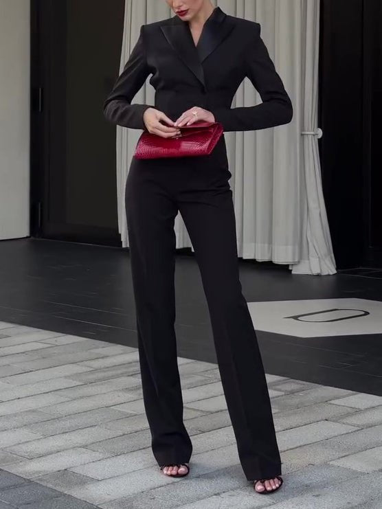 Front view: cropped double-breasted blazer with shiny lapels and straight full-length trousers