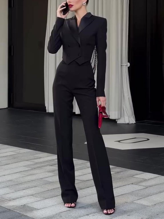 Model on the phone in the black set, a few bead strands visible at the side