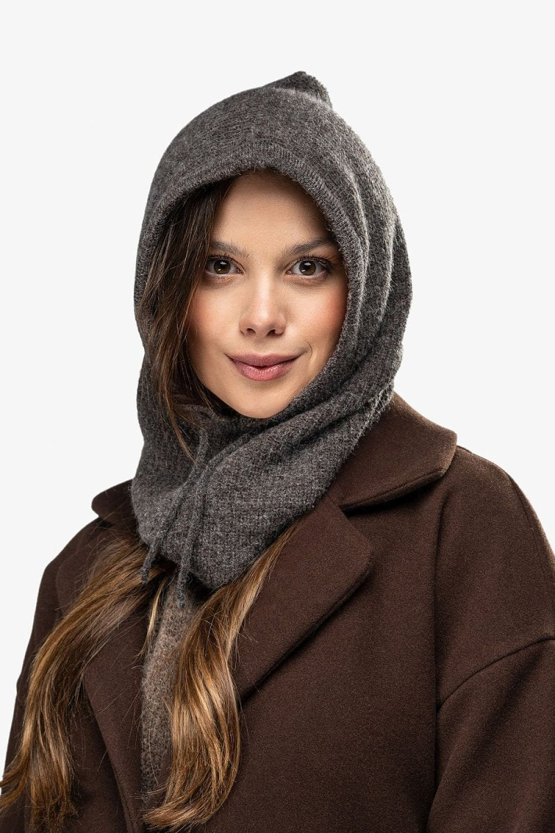 Woman wearing a warm wool blend balaclava and scarf set in winter style