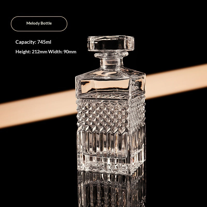 Melody bottle, cut glass spirits decanter with stopper, front view, clear, textured pattern, black background
