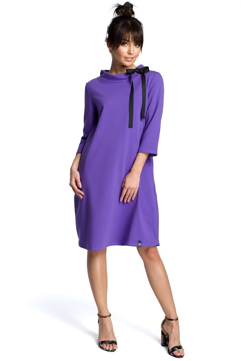 Elegant women's day dress in navy blue with subtle texture, lightweight fabric draping softly over the form