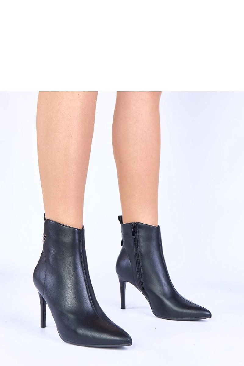 Black stiletto ankle boots on a model, Solea Women's Evening Footwear