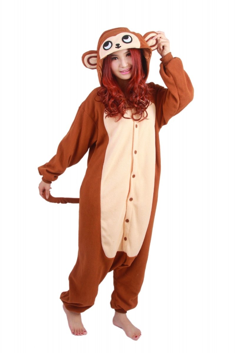 Woman in a brown monkey onesie with the hood up, cream belly panel with buttons and a tail at the side