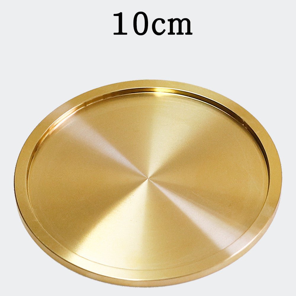 Brushed gold-tone metal coaster, 10 cm diameter, shown from top on light background