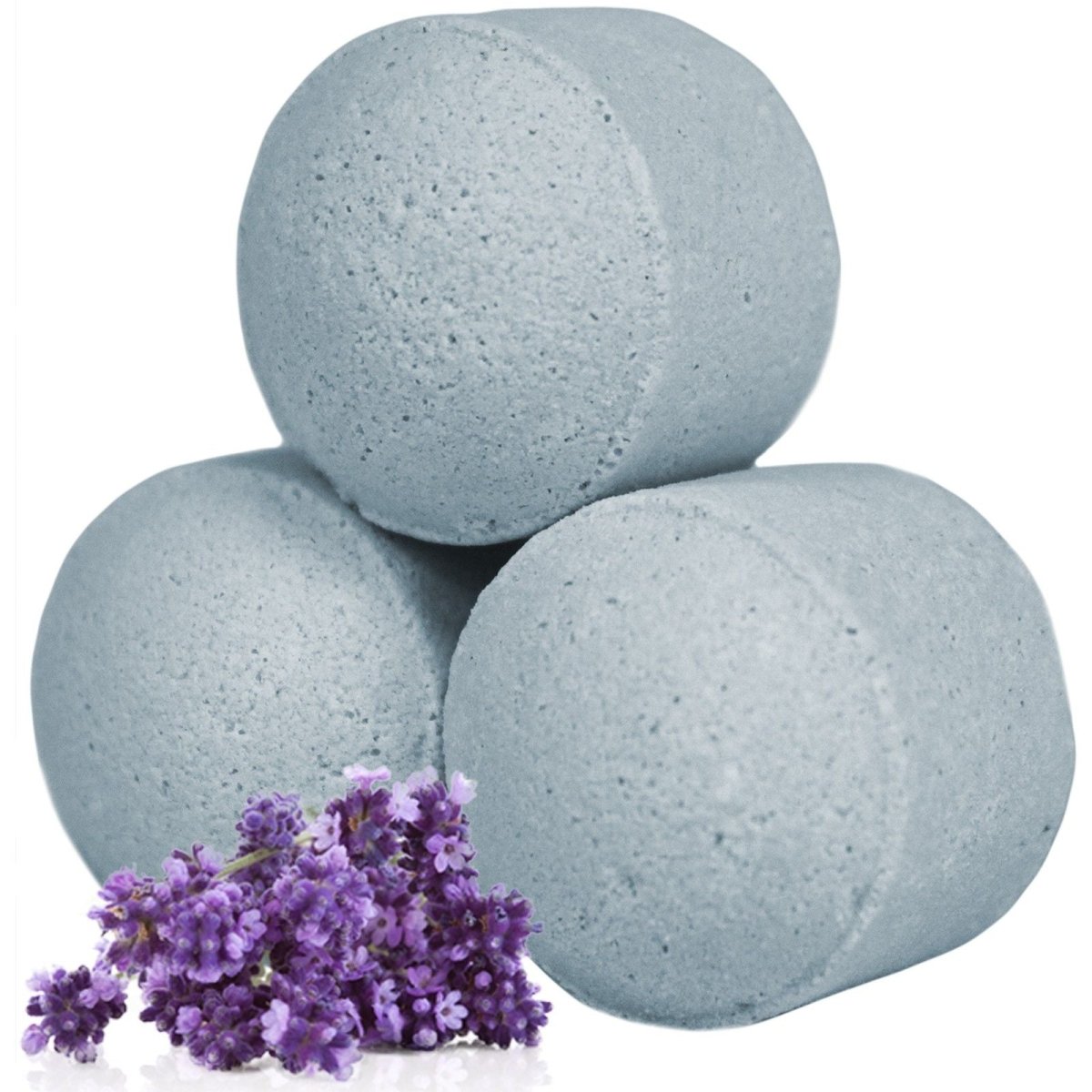 Bulk 13kg box of lavender-scented mini bath bombs dissolving in warm water