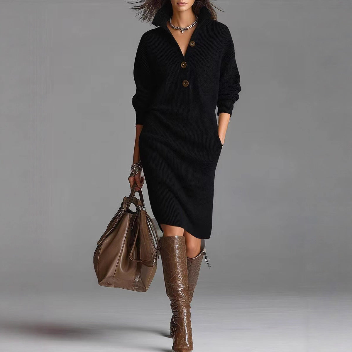 Collared knit sweater dress in black, front view on model, with button placket and side pockets, worn with boots and bag