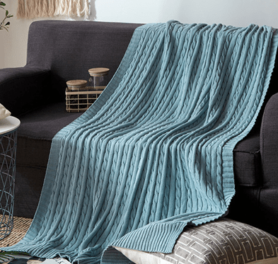 Cable Knit Throw with Ribbed Border in dusty blue
