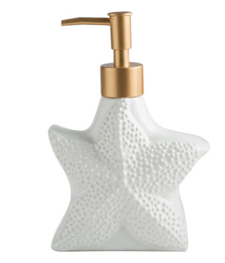 Starfish-shaped white ceramic dispenser with dotted surface and gold-tone pump, front view