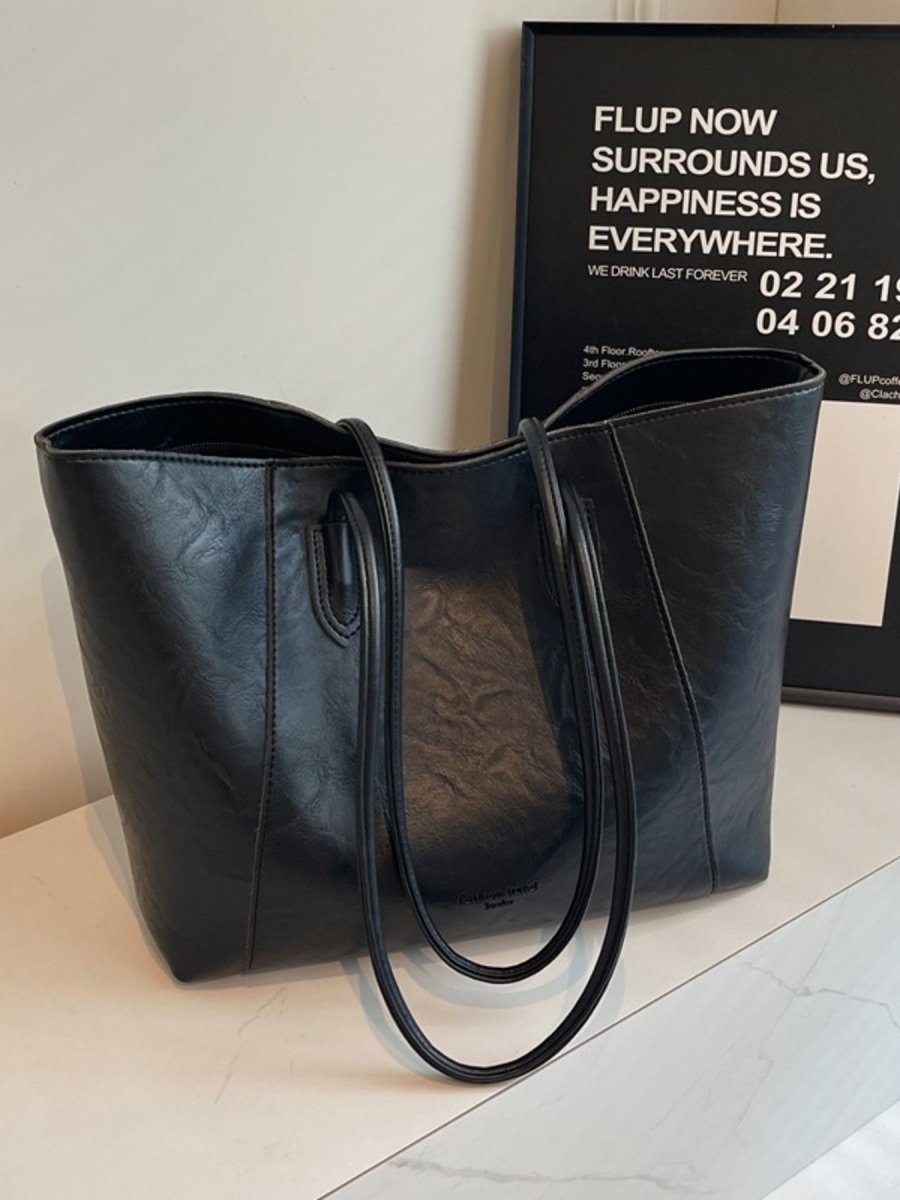 Classic Leather Tote Bag in black with structured silhouette and gold-tone hardware – spacious everyday handbag