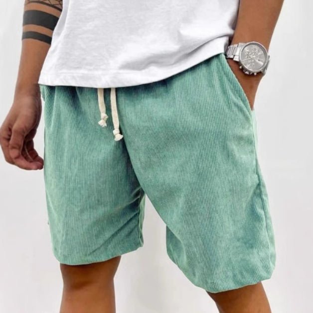 Mint green corduroy shorts with drawstring, worn with a white T-shirt