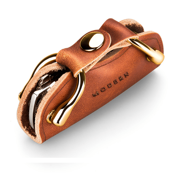 Back of the brown key organiser with a gold-tone snap button and key tips showing at the side