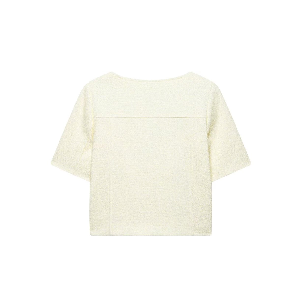 Back of the cream short-sleeve jacket with a seam across the shoulders