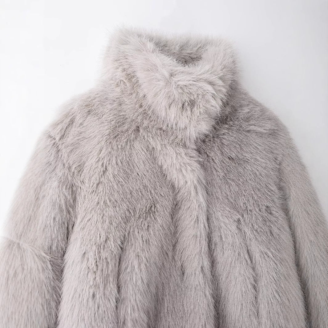 Close-up of the high collar and upper front of the light grey faux fur jacket