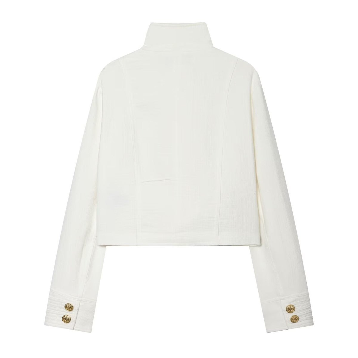 Back of the white cropped jacket with vertical seams and buttons at the cuffs