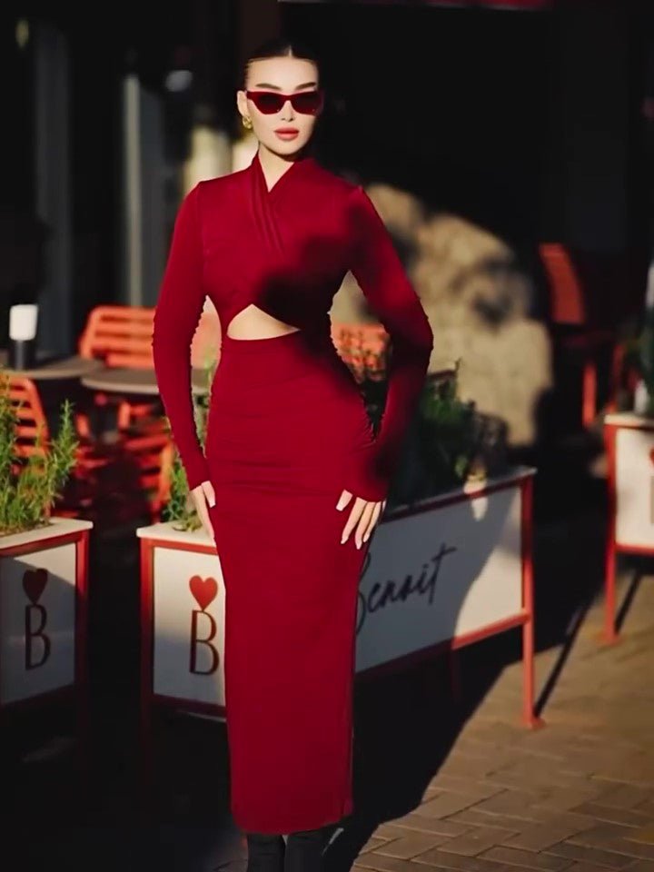 Model standing on a café terrace in the red long-sleeve maxi dress