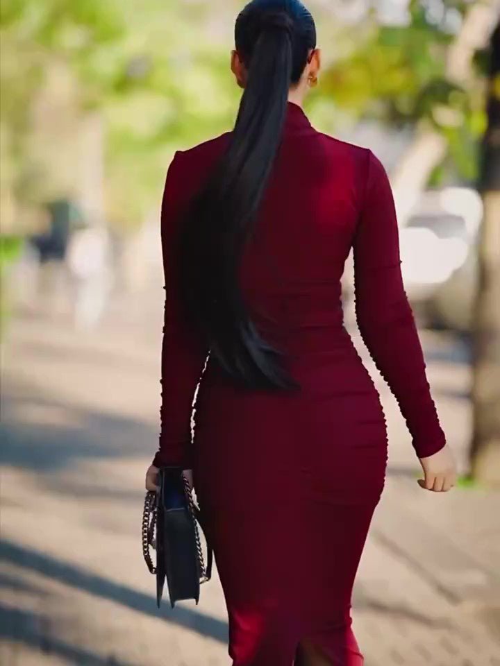 Back view of the red bodycon dress, high back and long sleeves, model with a long ponytail