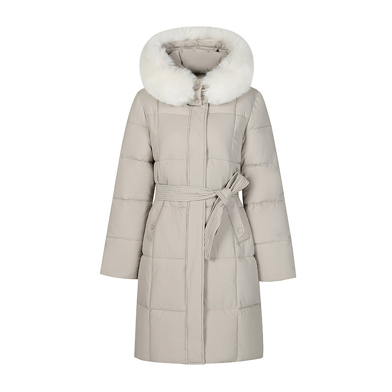 Mid-length padded coat in light beige with faux-fur hood and tie belt, front view on white background
