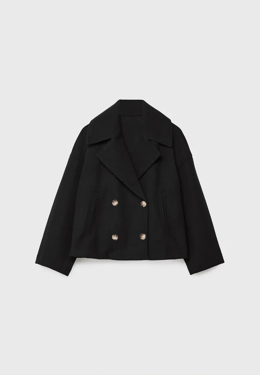 Cropped double-breasted jacket in black, flat lay, front view, on a light background