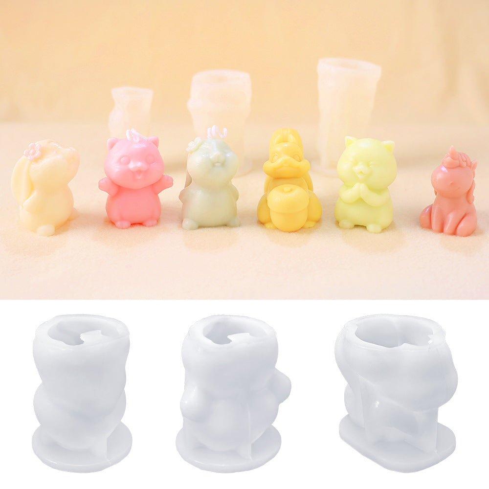 Animal silicone candle moulds, four designs, shown with coloured candles in front, white moulds behind, on a light surface