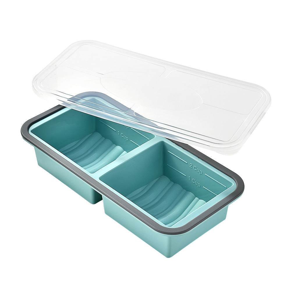 Two-compartment silicone freezer portion tray, teal colour, grey rim, clear lid, measuring marks, front view