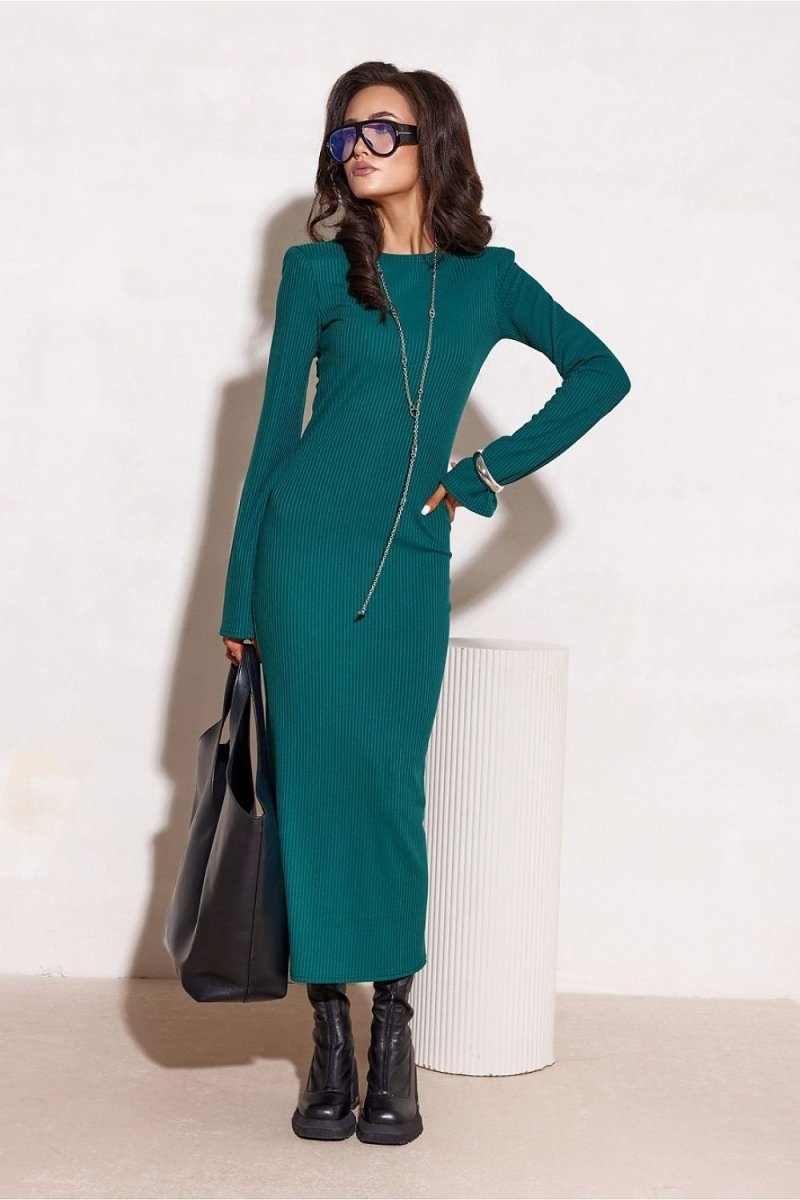 Model wearing green knit day dress Roco Fashion slim fit on city street