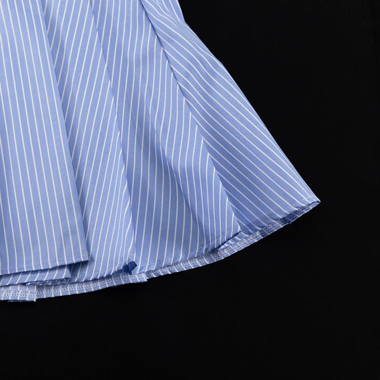 Detail of the blue and white striped shirt hem with folded edge