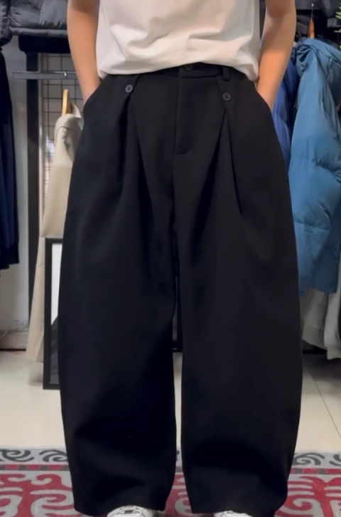 Men's double-pleated wide-leg trousers in black, front view on model, ankle-length, regular fit, hands in pockets