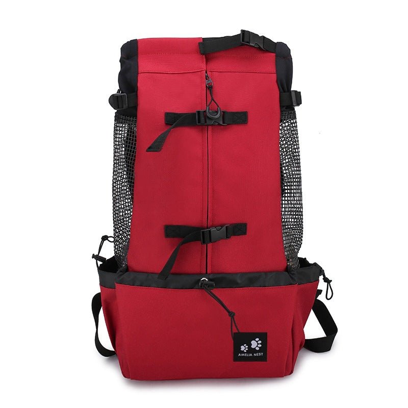 Red dog backpack carrier on a white background, front view with mesh sides