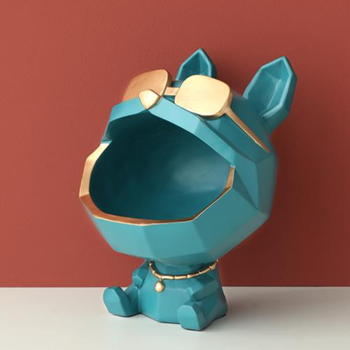 Teal dog figure seen from the front, showing the smooth inside of the mouth and the gold-tone rim